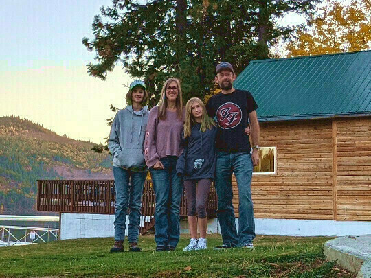 Zoe, Colin, Mandi and Daisy Conway anticipating more snow by pretending to be skiing and boarding on the beach